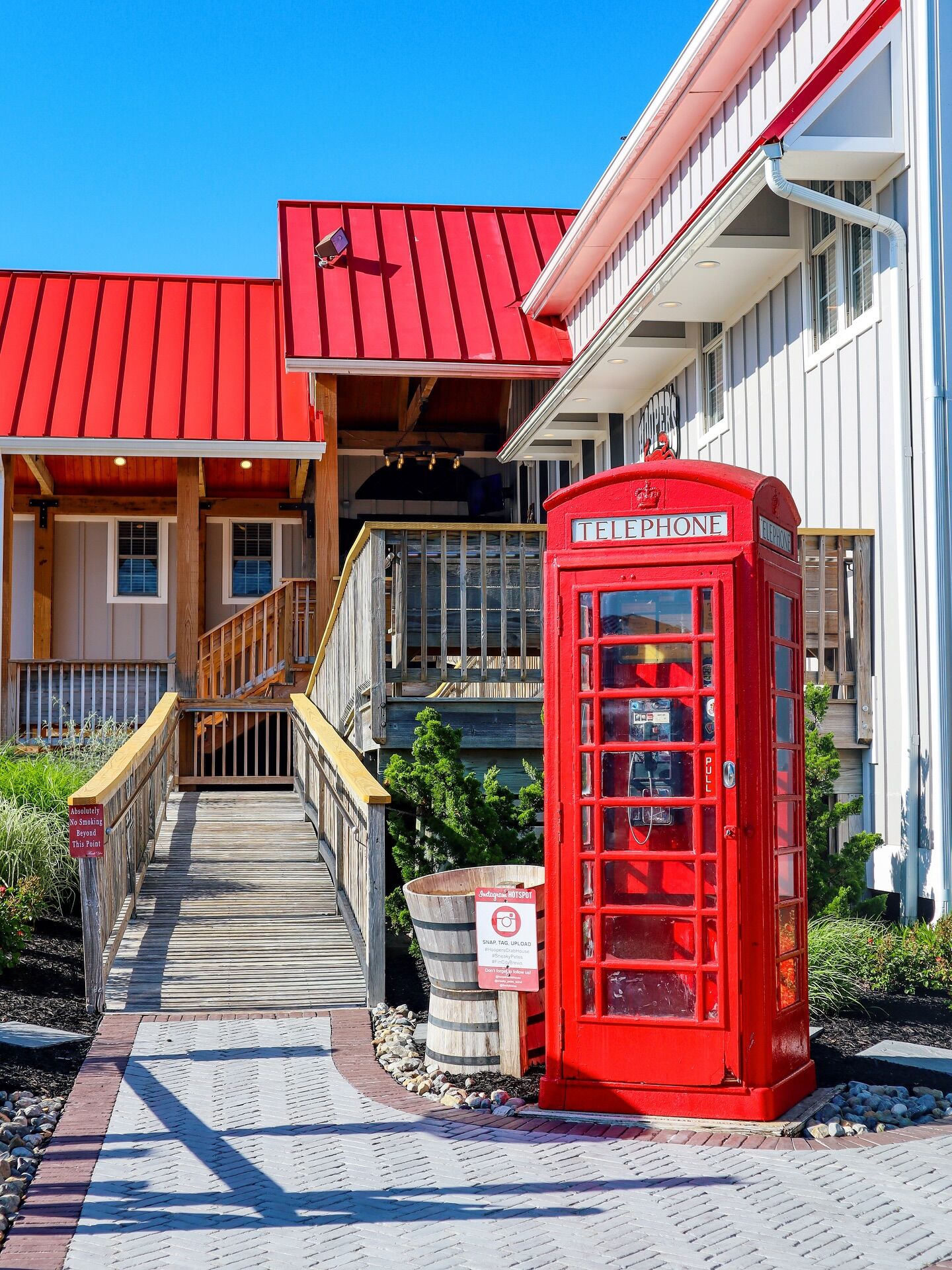 Adirondack chairs and phone booth outside Hooper's Crab House