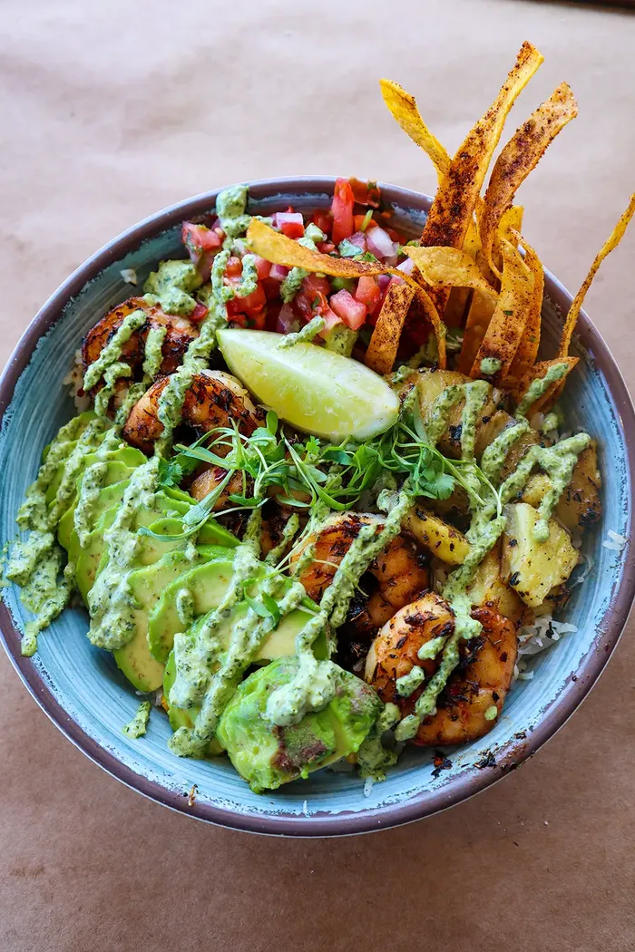 Shrimp avocado bowl with crispy tortilla strips